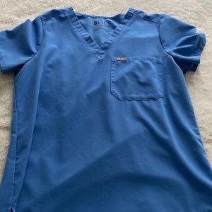 Ceil blue scrubs set from figs. Top is a M. Bottoms are a small tall.
